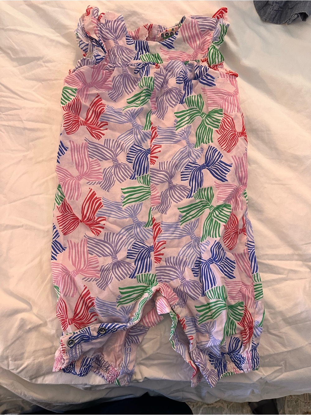 Baby Boden Pink Print Cotton Romper with Green, Blue, and Red bows